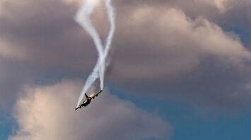 Plane spiraling downwards leaving smoke trails