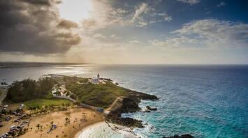 Scenic coastal view with a lighthouse and beach