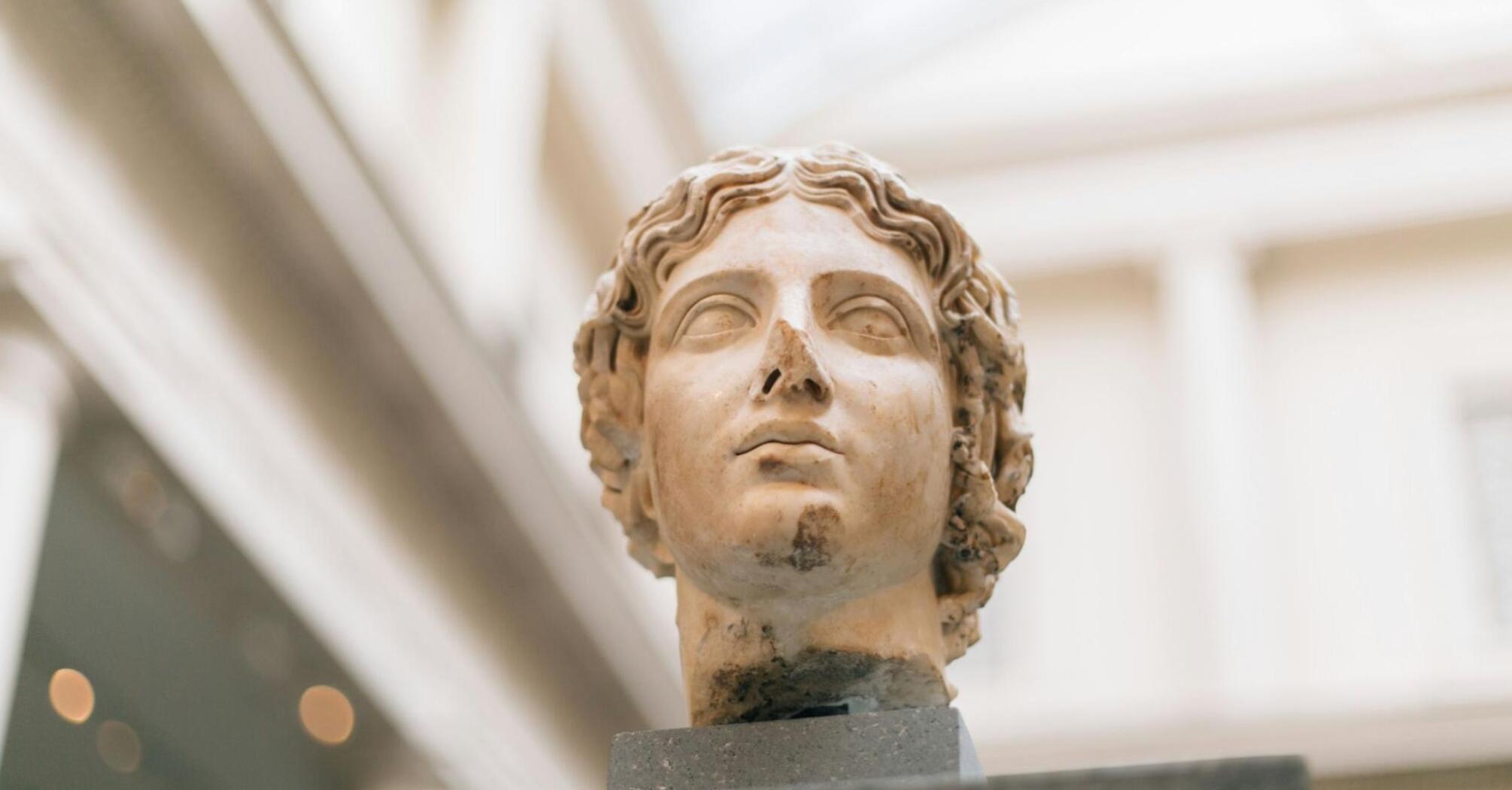 Marble sculpture of a man's head in a museum