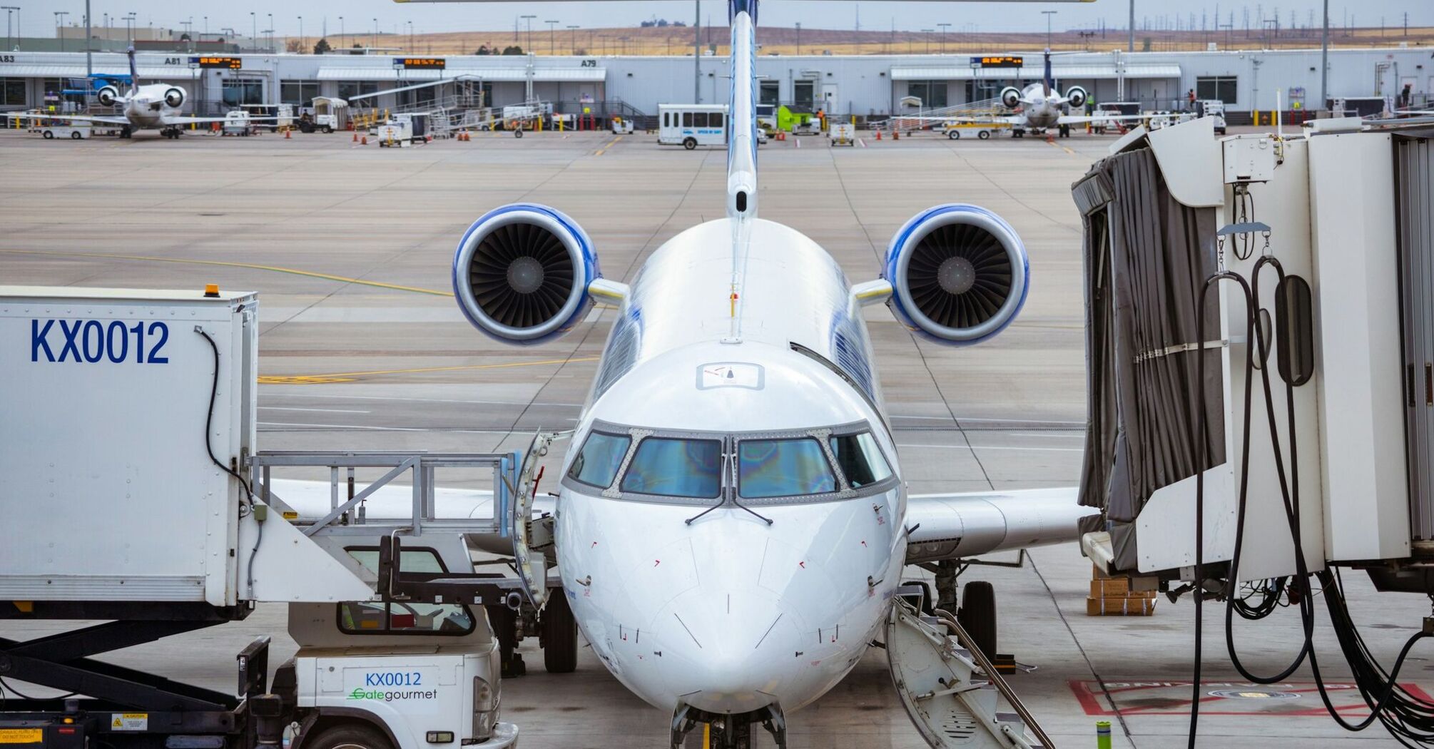 a large jetliner sitting on top of an airport tarmac