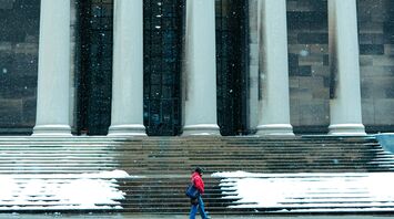 The Mellon Institute and a passerby on a snowy day