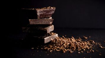 Luxury chocolate bars with cocoa beans
