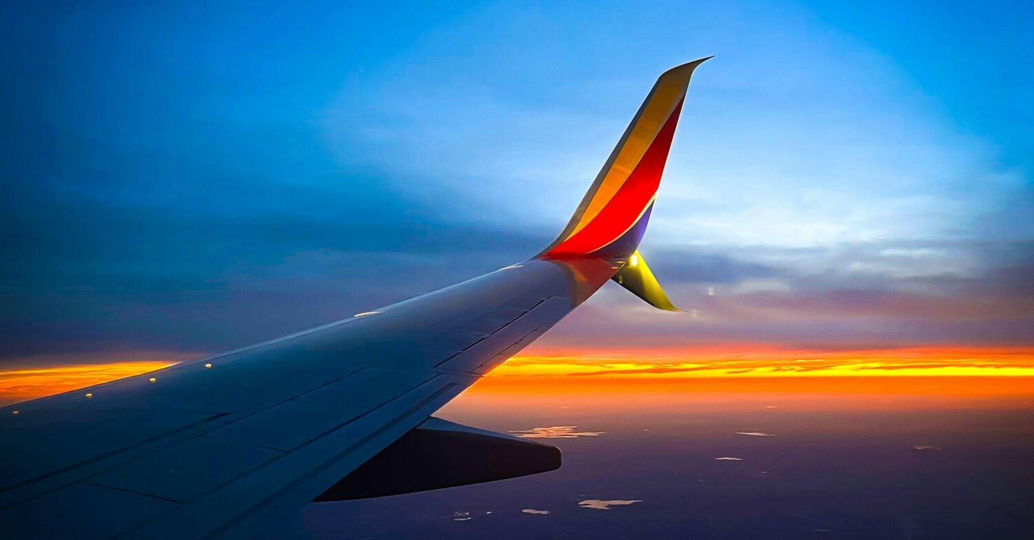 Southwest Airlines airplane wing during sunset