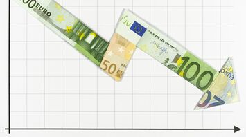 Graph showing fluctuating arrow made from euro banknotes