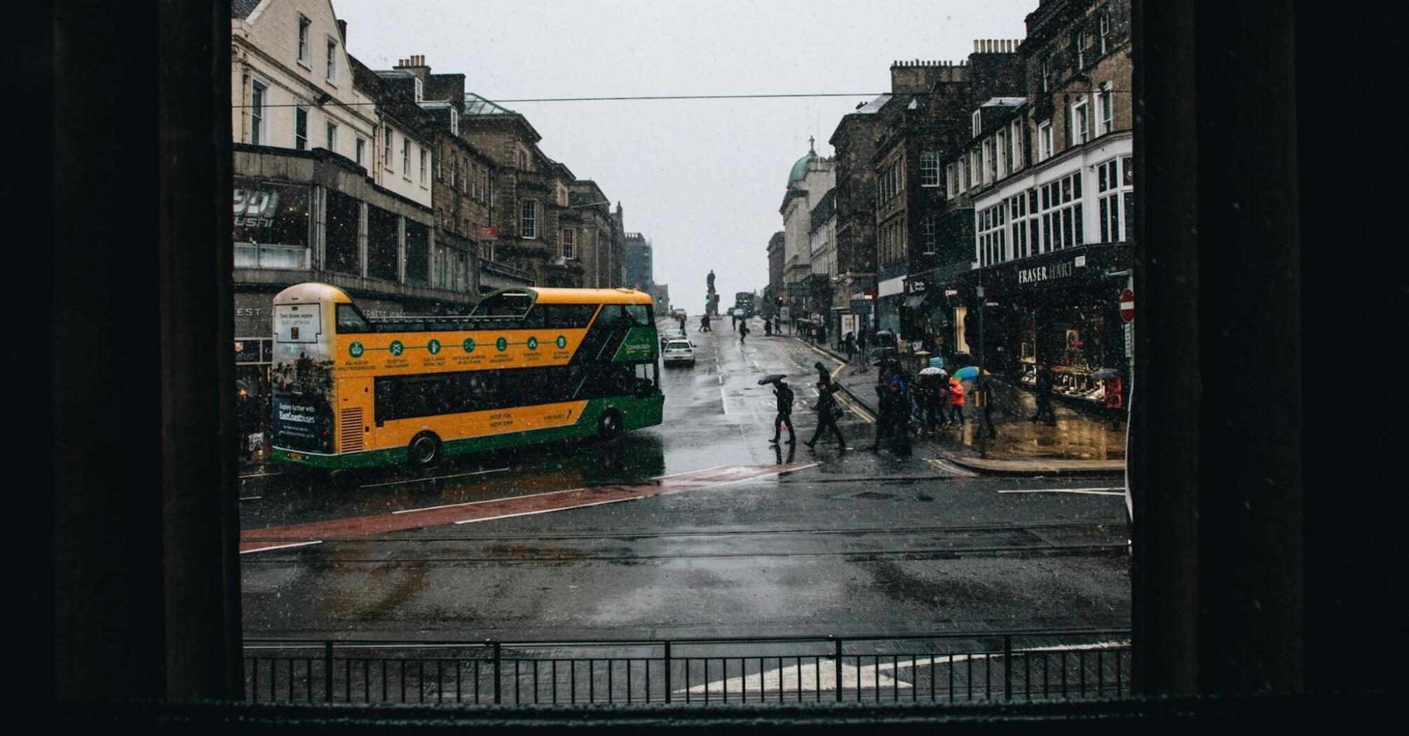 A rainy day in Edinburgh with a bus on the street