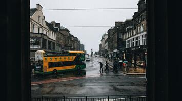 A rainy day in Edinburgh with a bus on the street