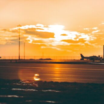 Airplanes at sunset on a quiet airport runway