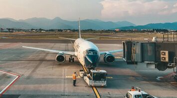 white airplane on airport during daytime