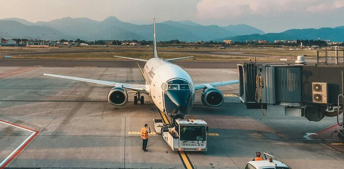 white airplane on airport during daytime