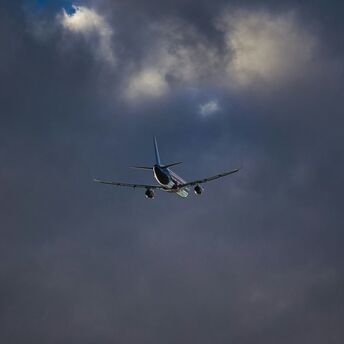 Airplane flying through stormy clouds