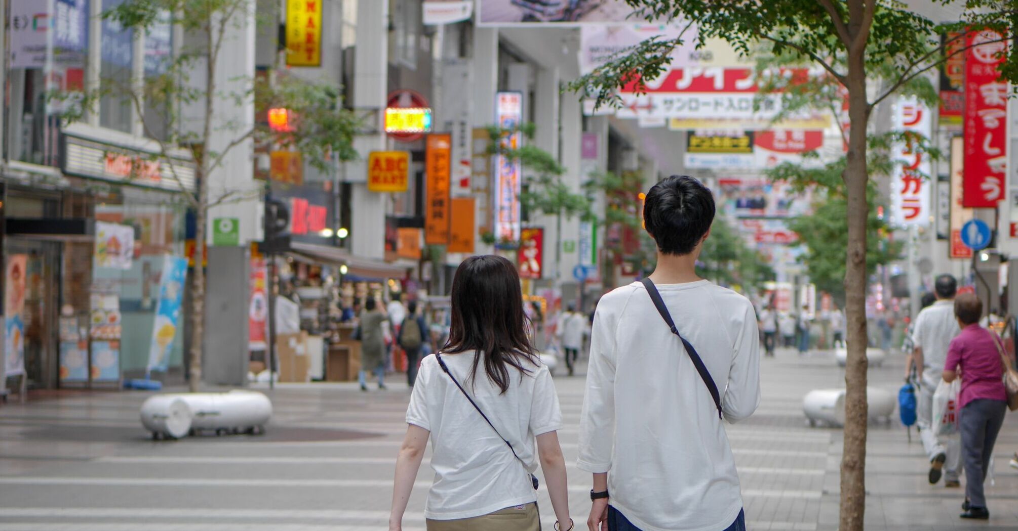 Couple walking on a street in Japan