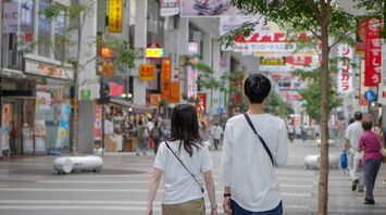 Couple walking on a street in Japan