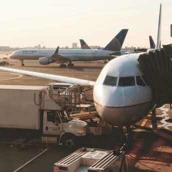 white airplanes at airport during daytime