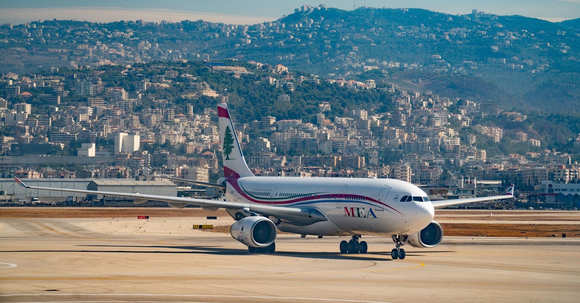 Airplane at Lebanon Airport with cityscape in the background