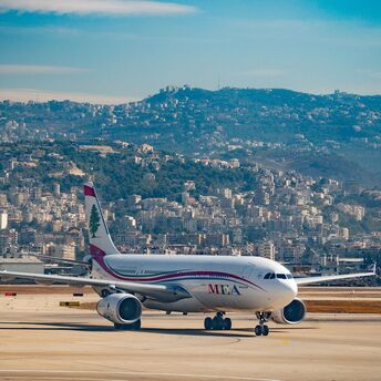 Airplane at Lebanon Airport with cityscape in the background