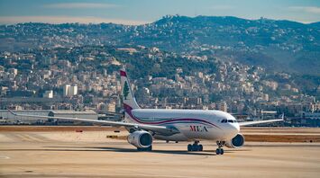 Airplane at Lebanon Airport with cityscape in the background
