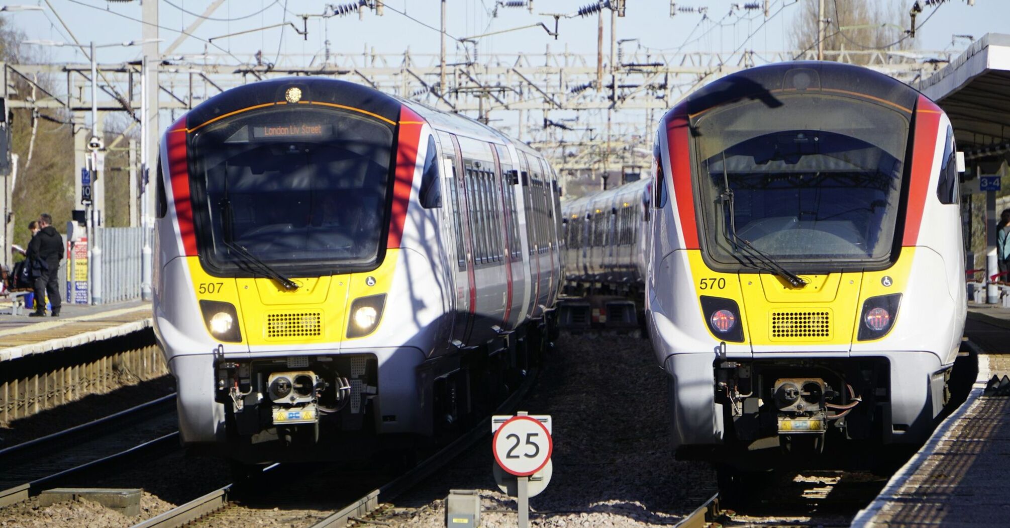 Two Greater Anglia trains at a station platform