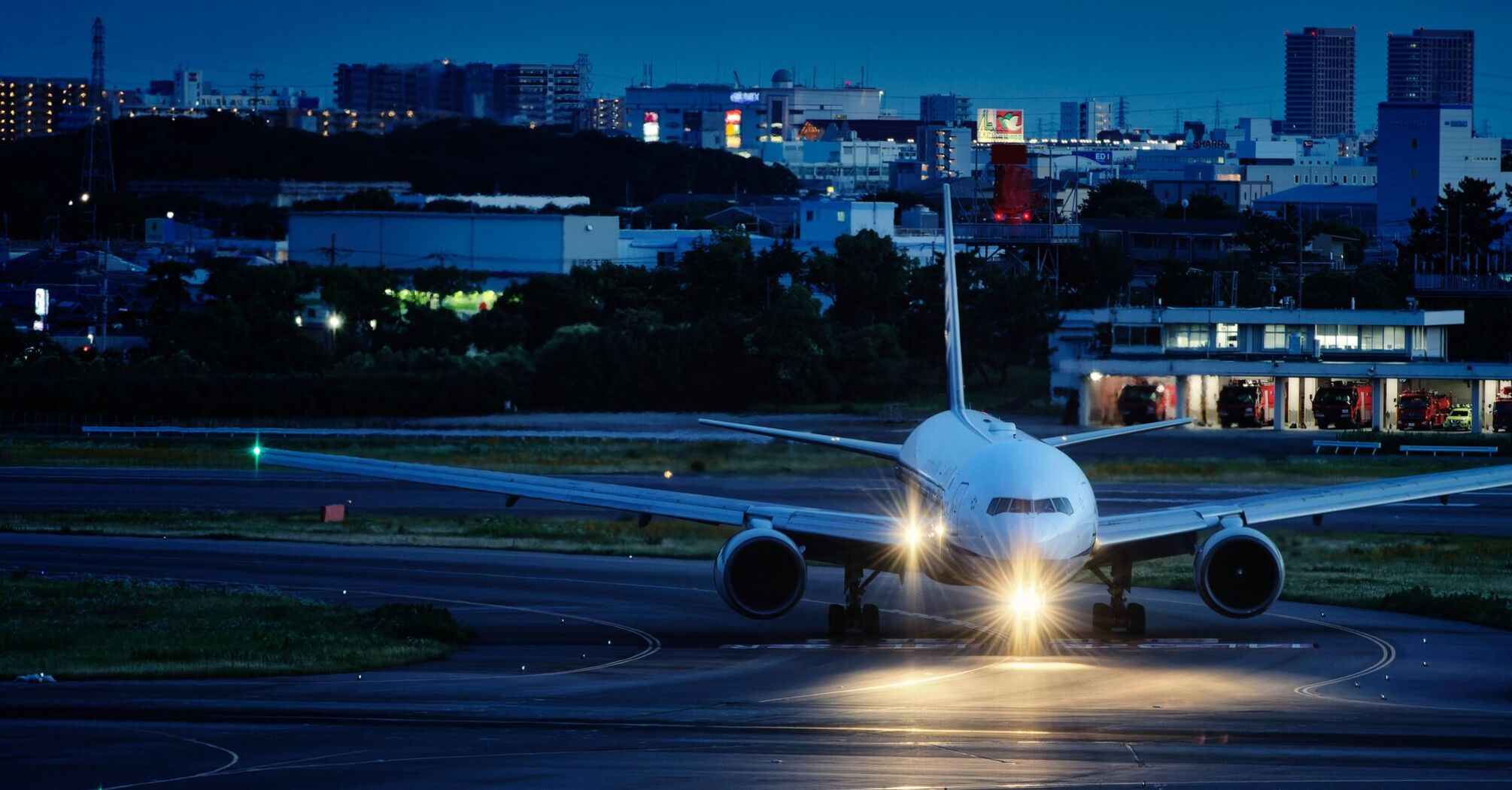 a large jetliner sitting on top of an airport runway