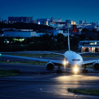 a large jetliner sitting on top of an airport runway