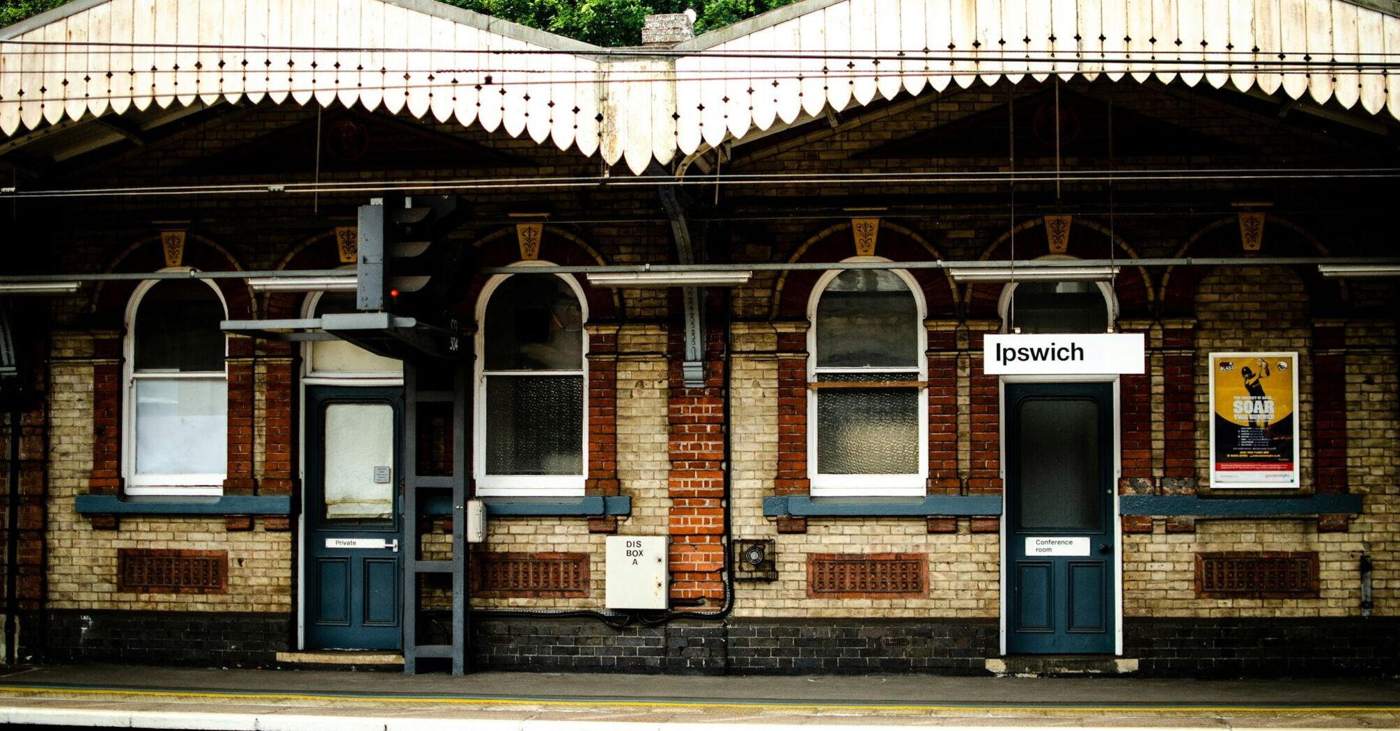 Ipswich railway station platform with historic brick architecture