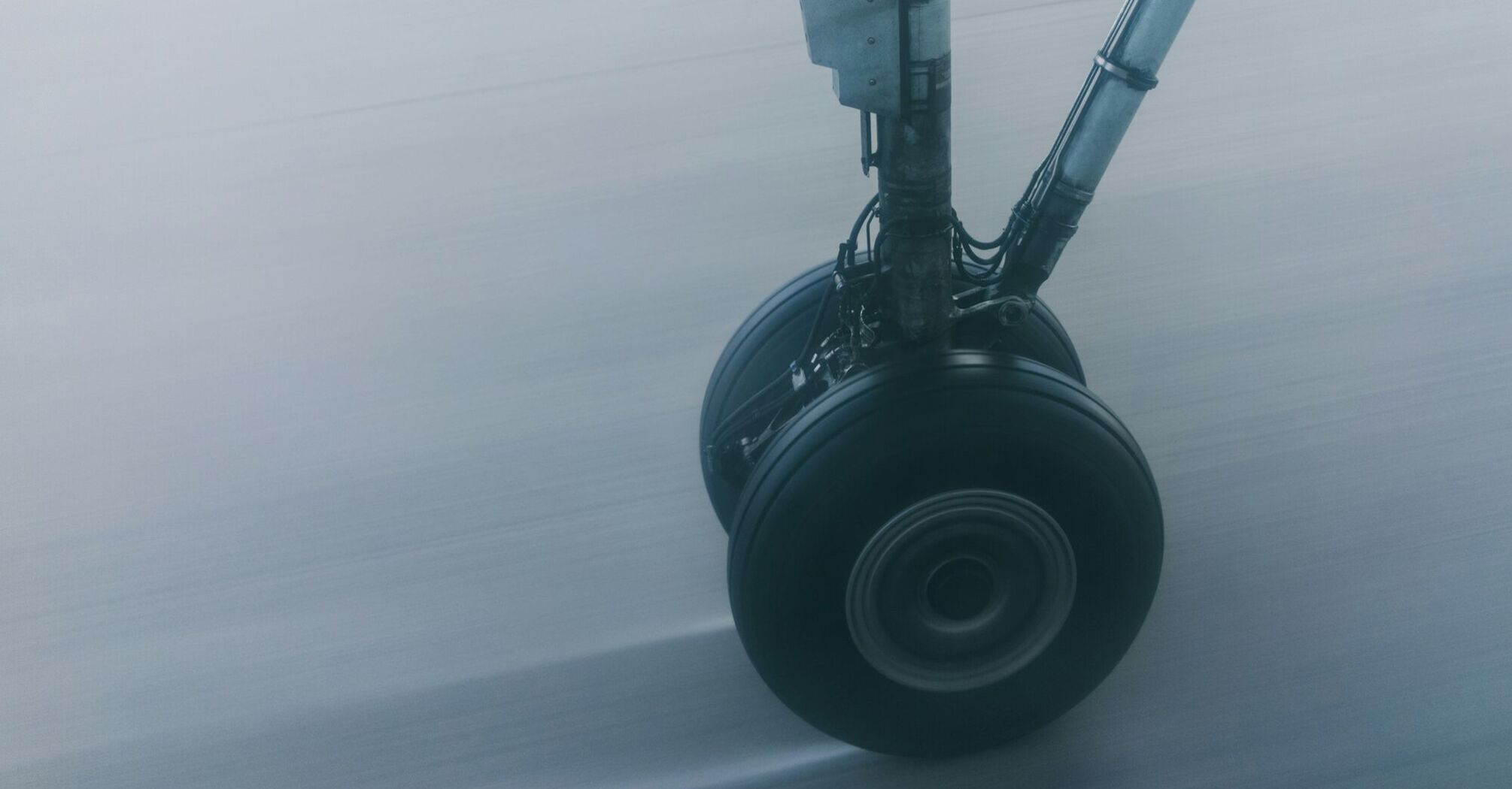 Close-up of aircraft landing gear in motion