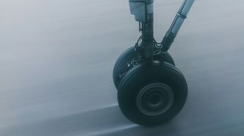 Close-up of aircraft landing gear in motion