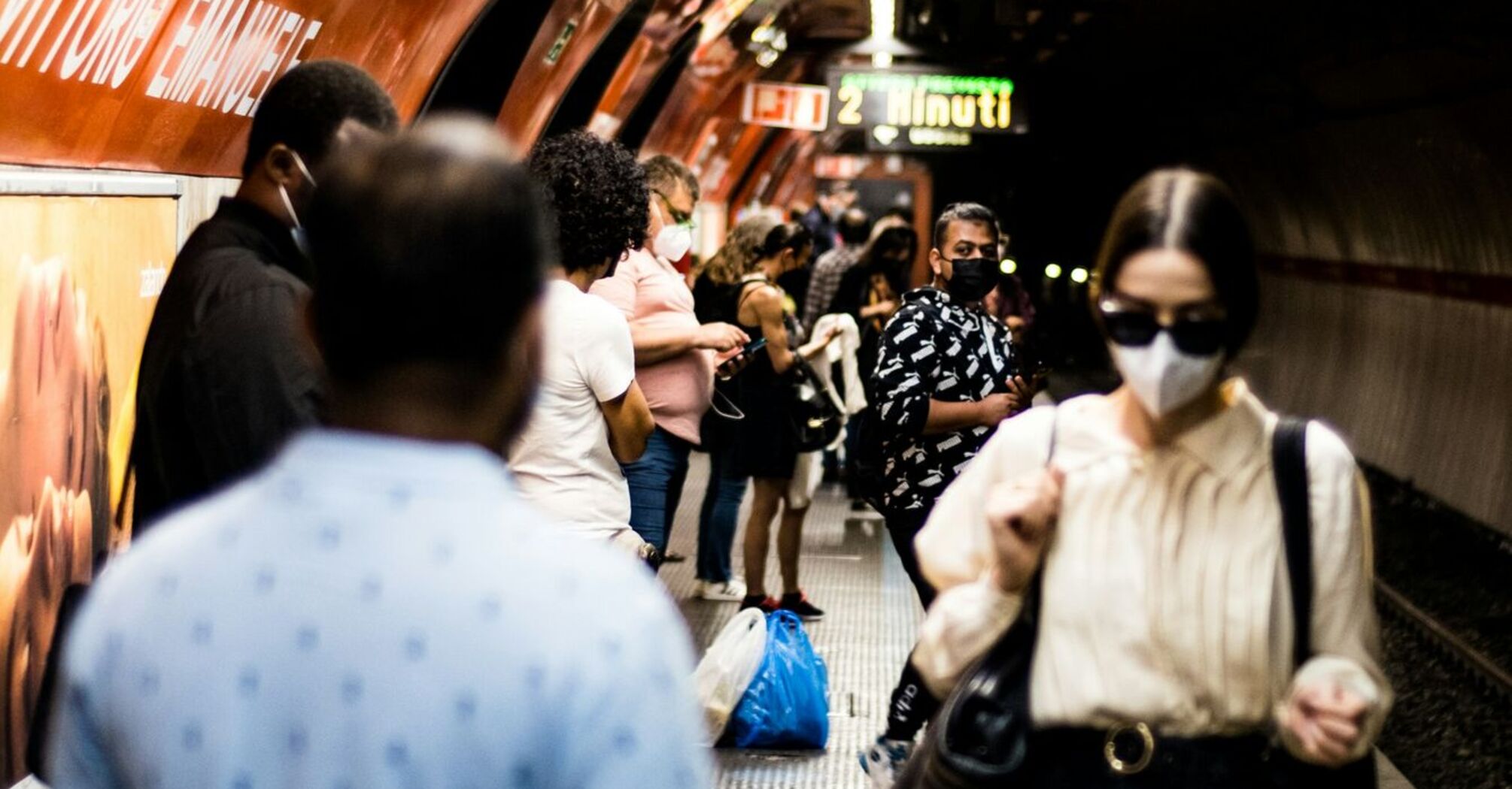 Commuters waiting on a crowded Rome Metro platform