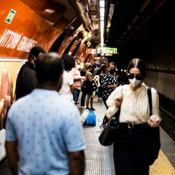 Commuters waiting on a crowded Rome Metro platform