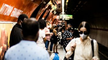 Commuters waiting on a crowded Rome Metro platform