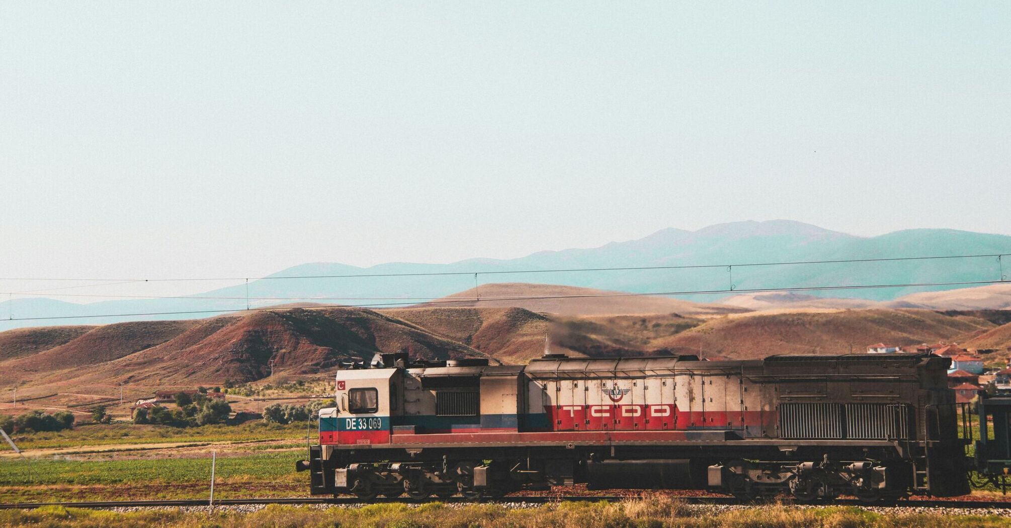 a train travels down the tracks