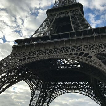 View of the Eiffel Tower from below on a cloudy day