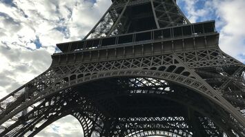 View of the Eiffel Tower from below on a cloudy day