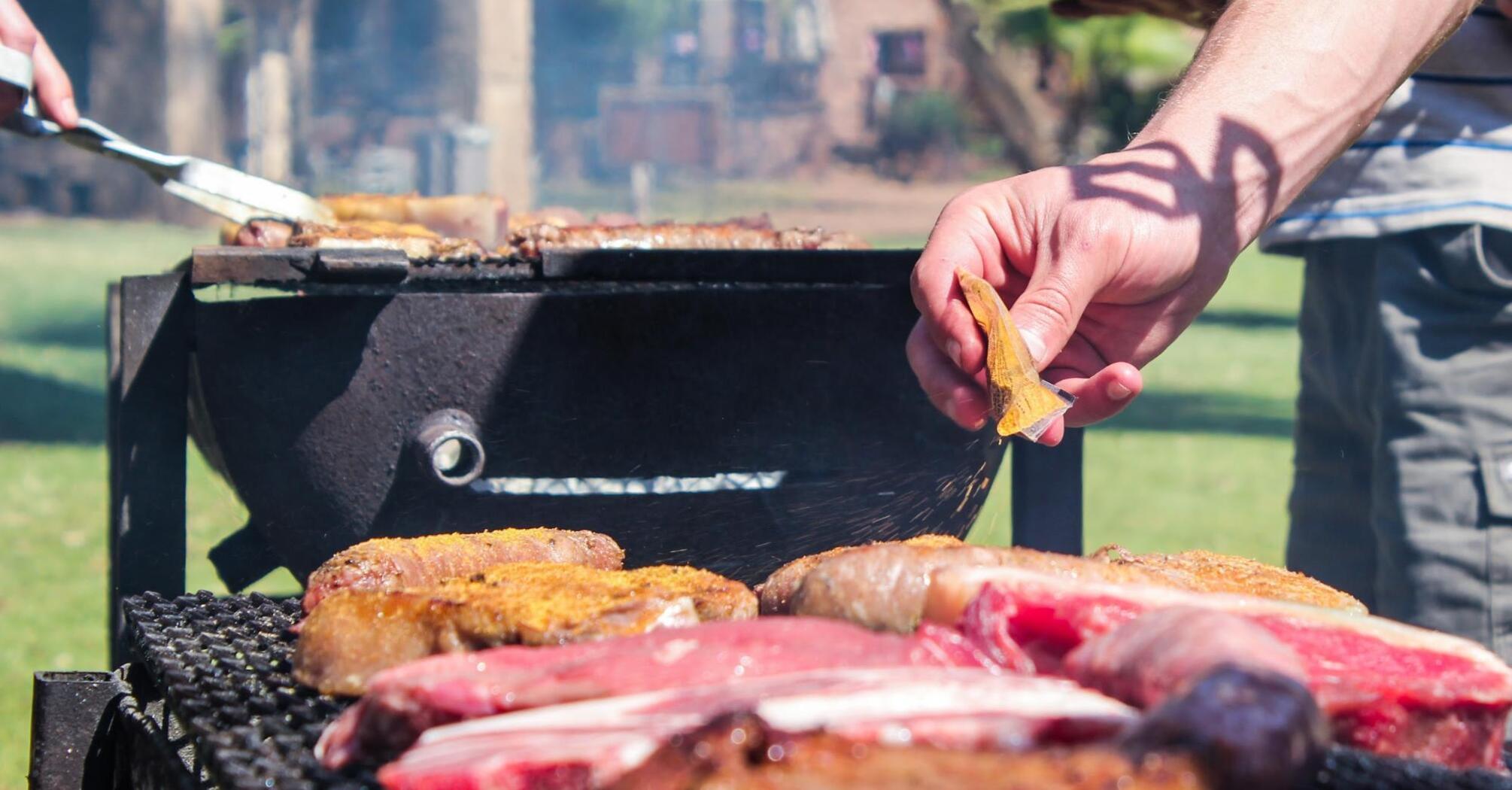 Grilling meat during an outdoor barbecue