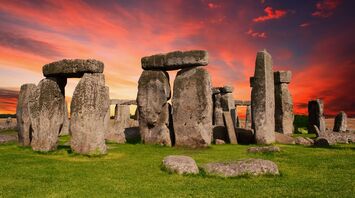 Stonehenge at sunset with vibrant skies