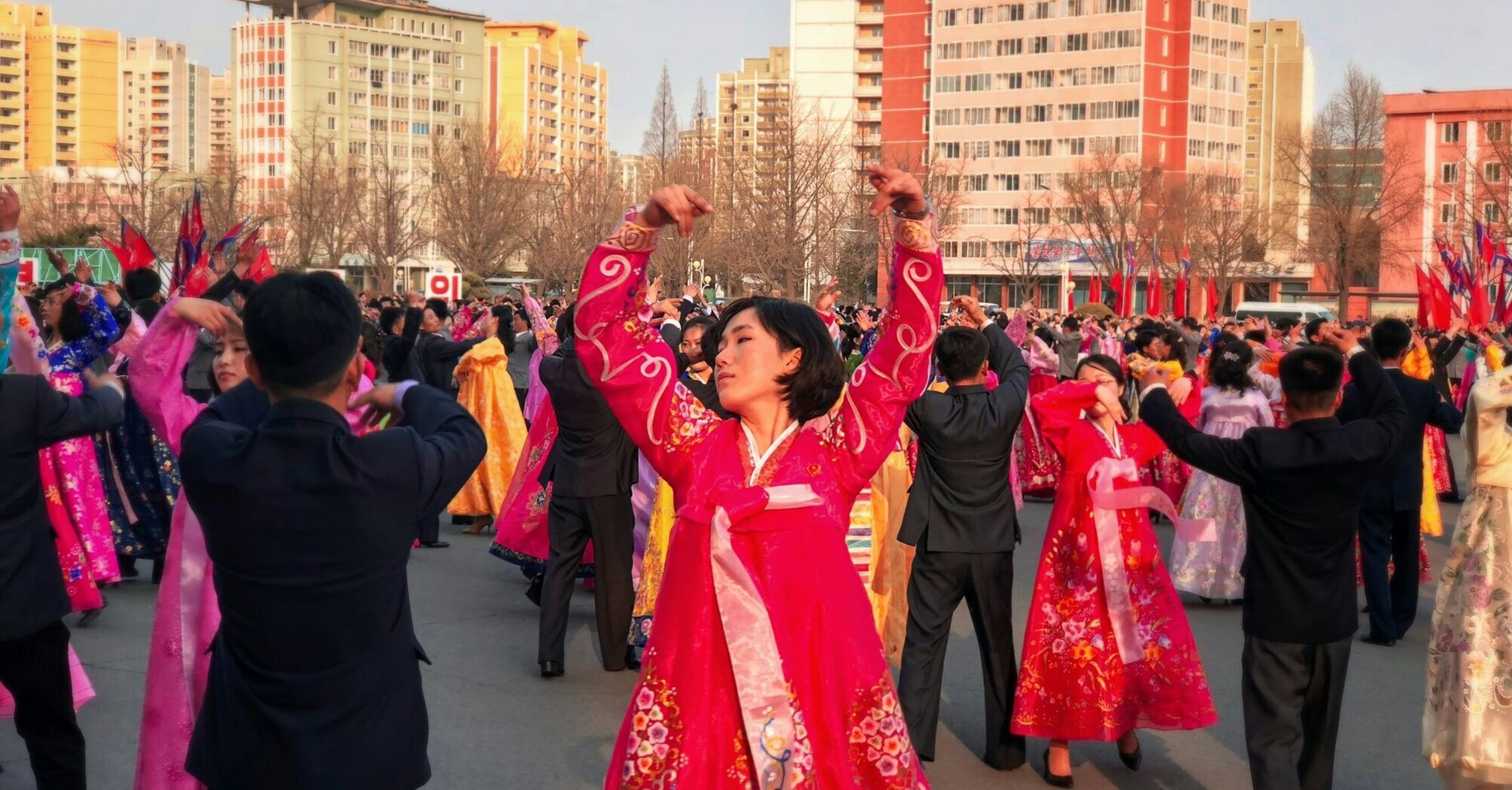 Traditional dance performance in North Korea with participants wearing colorful hanbok