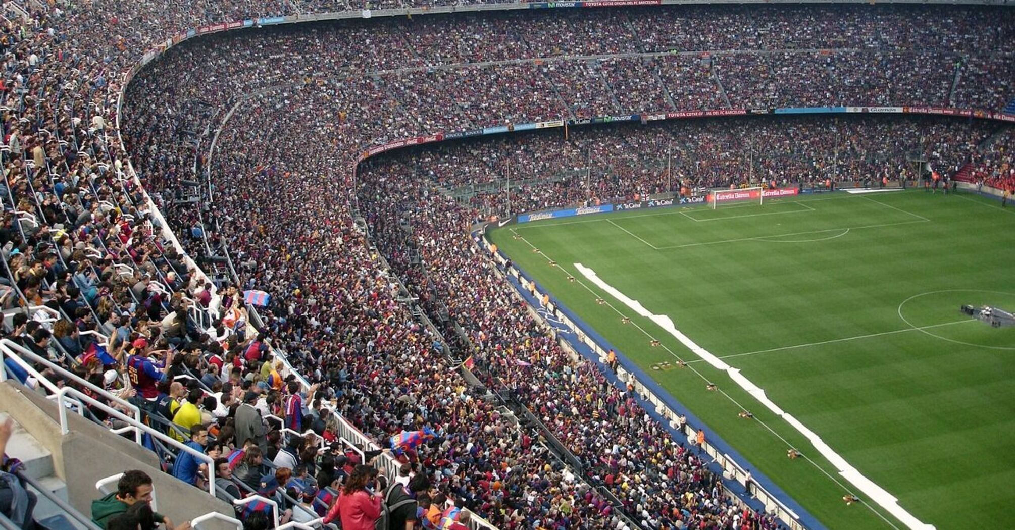 A packed stadium filled with football fans during a match