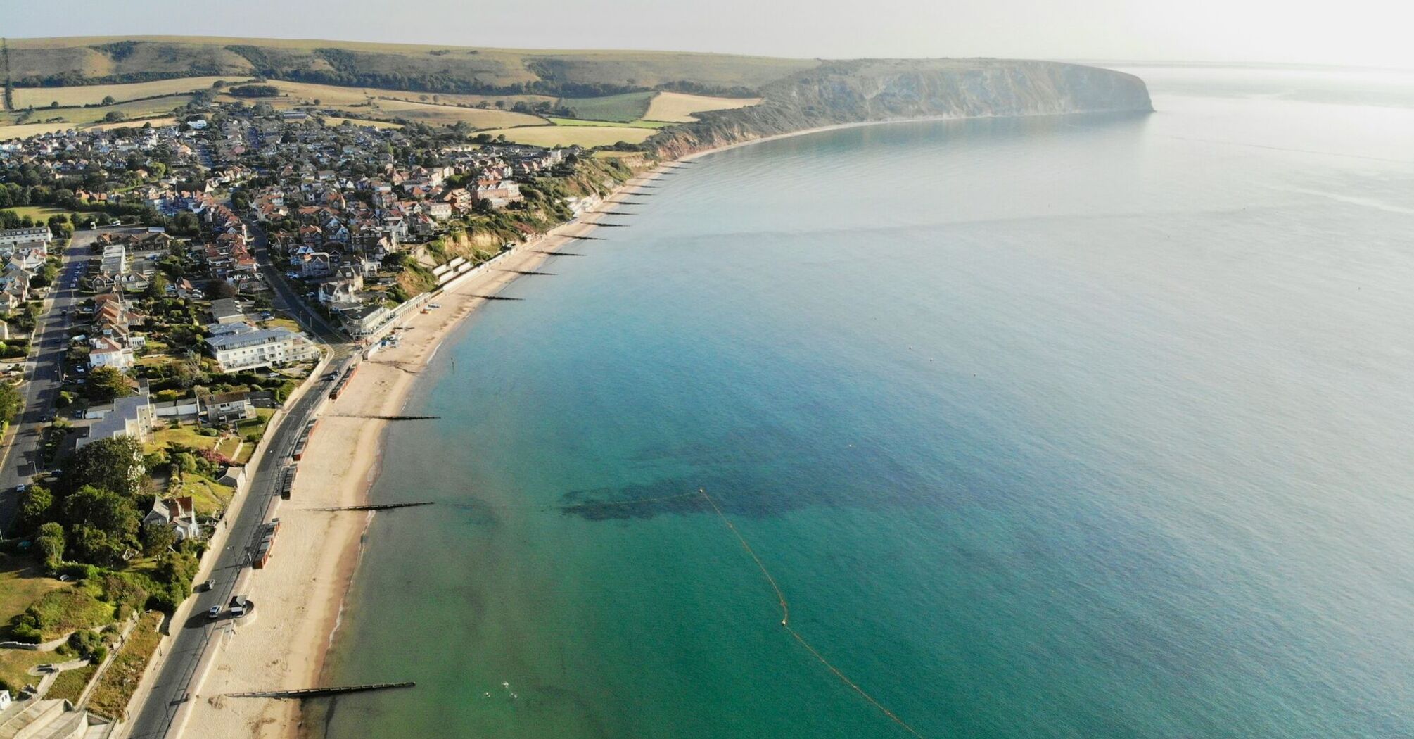 Aerial view of Swanage Bay with its sandy beach and surrounding coastline