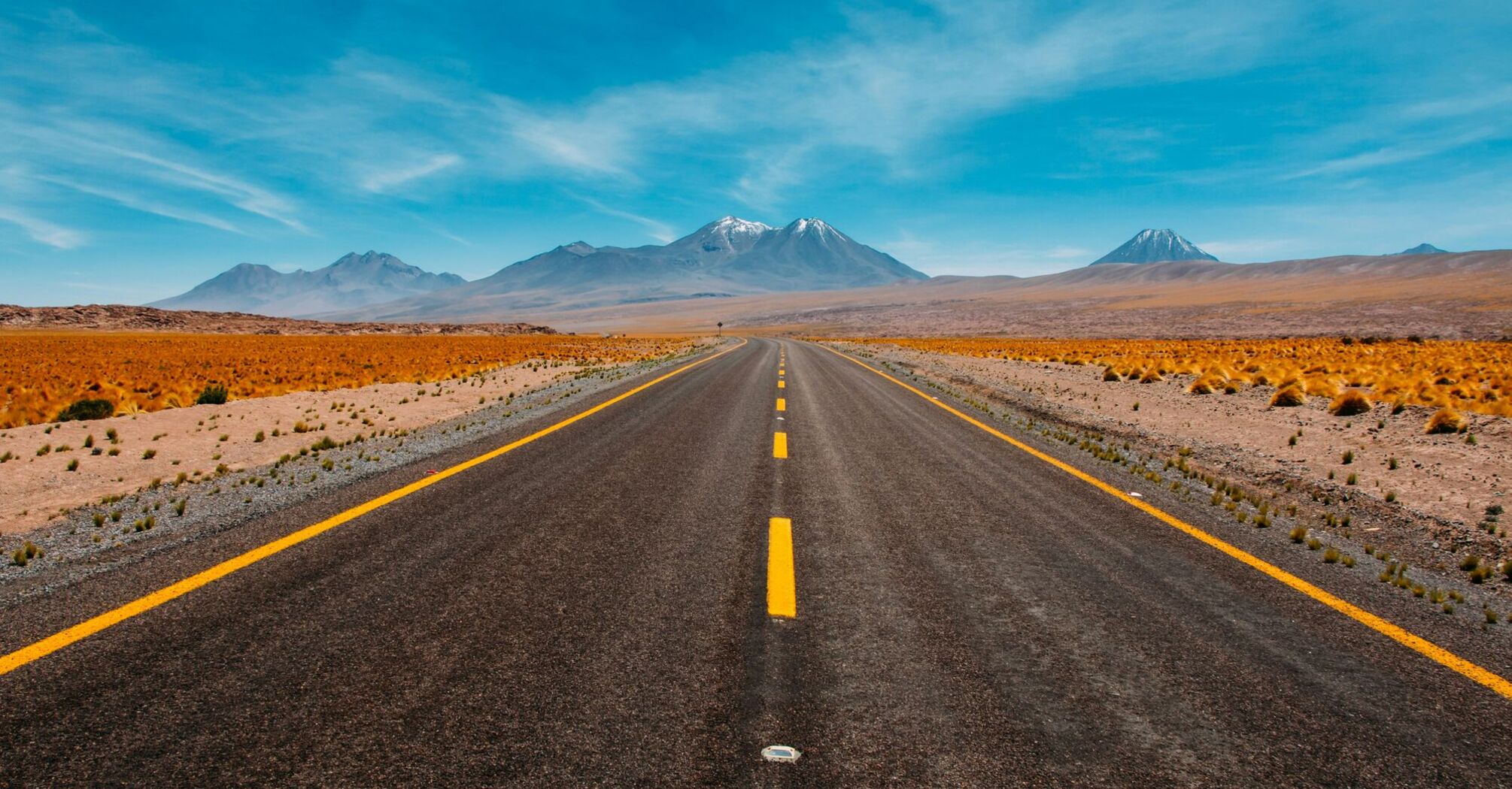 lone road going to mountains