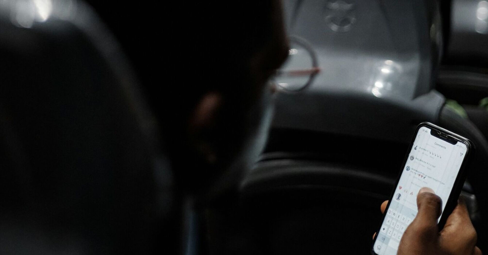 Passenger using a smartphone while riding on a bus