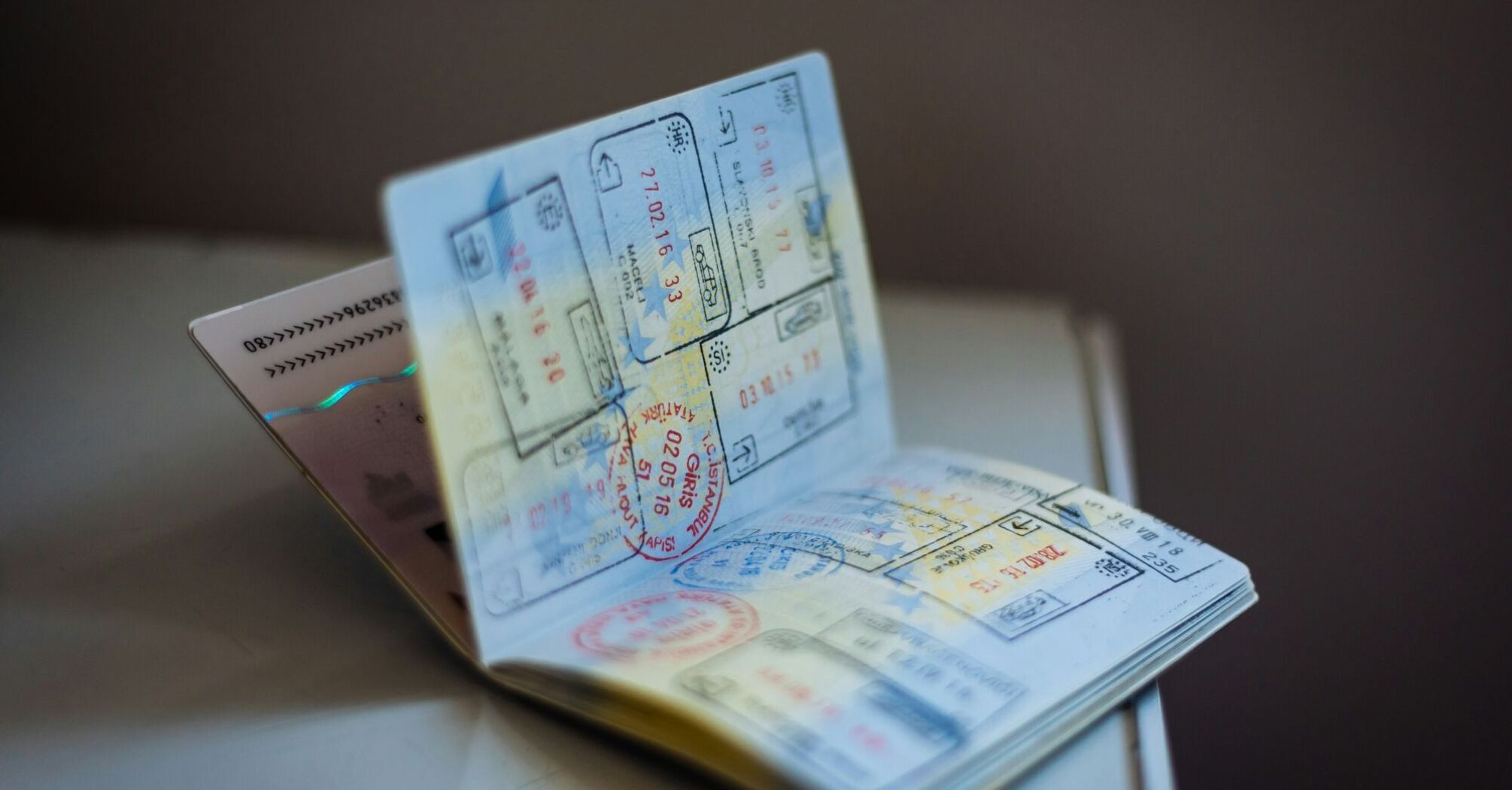 Open passport showing multiple visa stamps from different countries