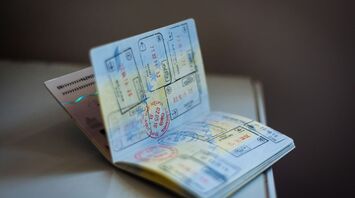 Open passport showing multiple visa stamps from different countries