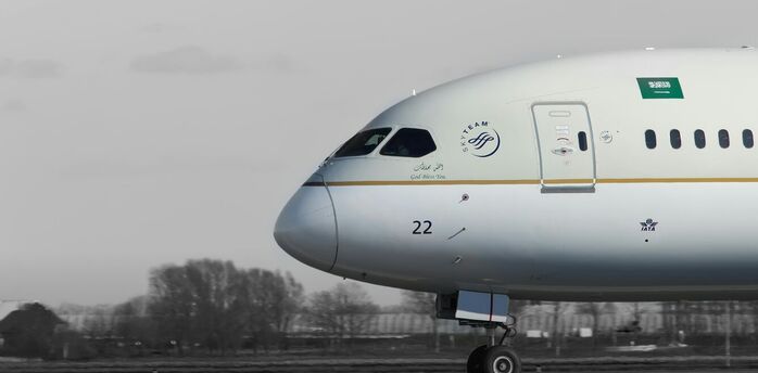 a large jetliner sitting on top of an airport runway