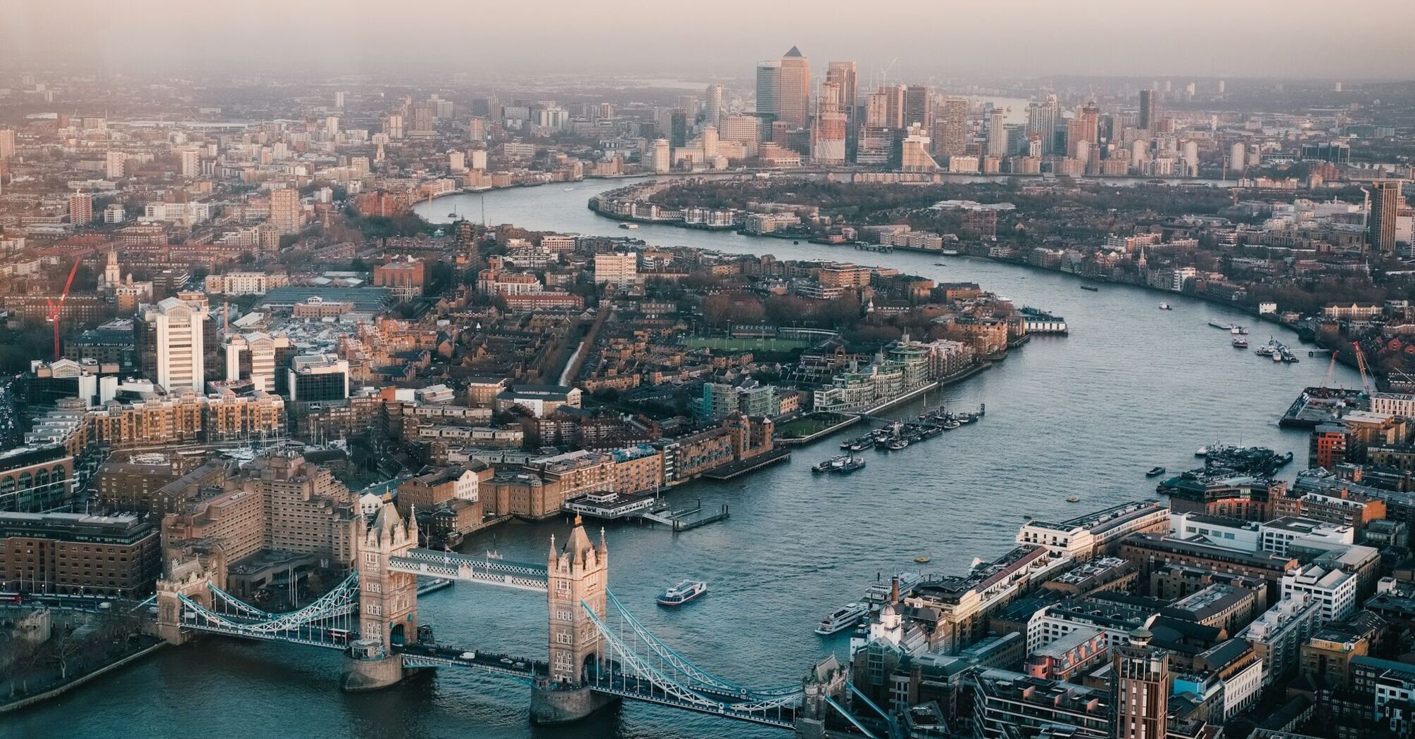 Aerial view of London with the Thames River and Tower Bridge