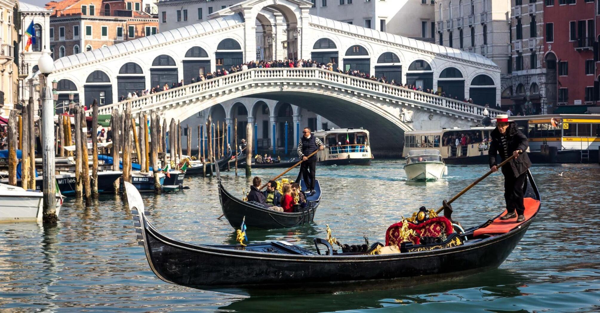 Gondolas on the canal in front of Rialto Bridge, Venice