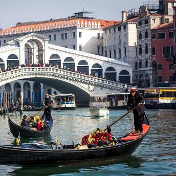 Gondolas on the canal in front of Rialto Bridge, Venice