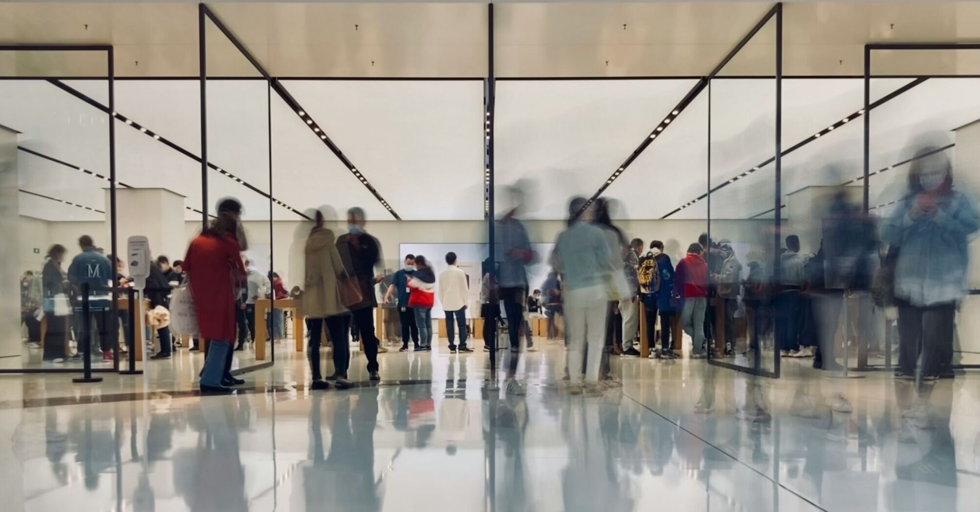 Crowded airport terminal with blurred motion of passengers