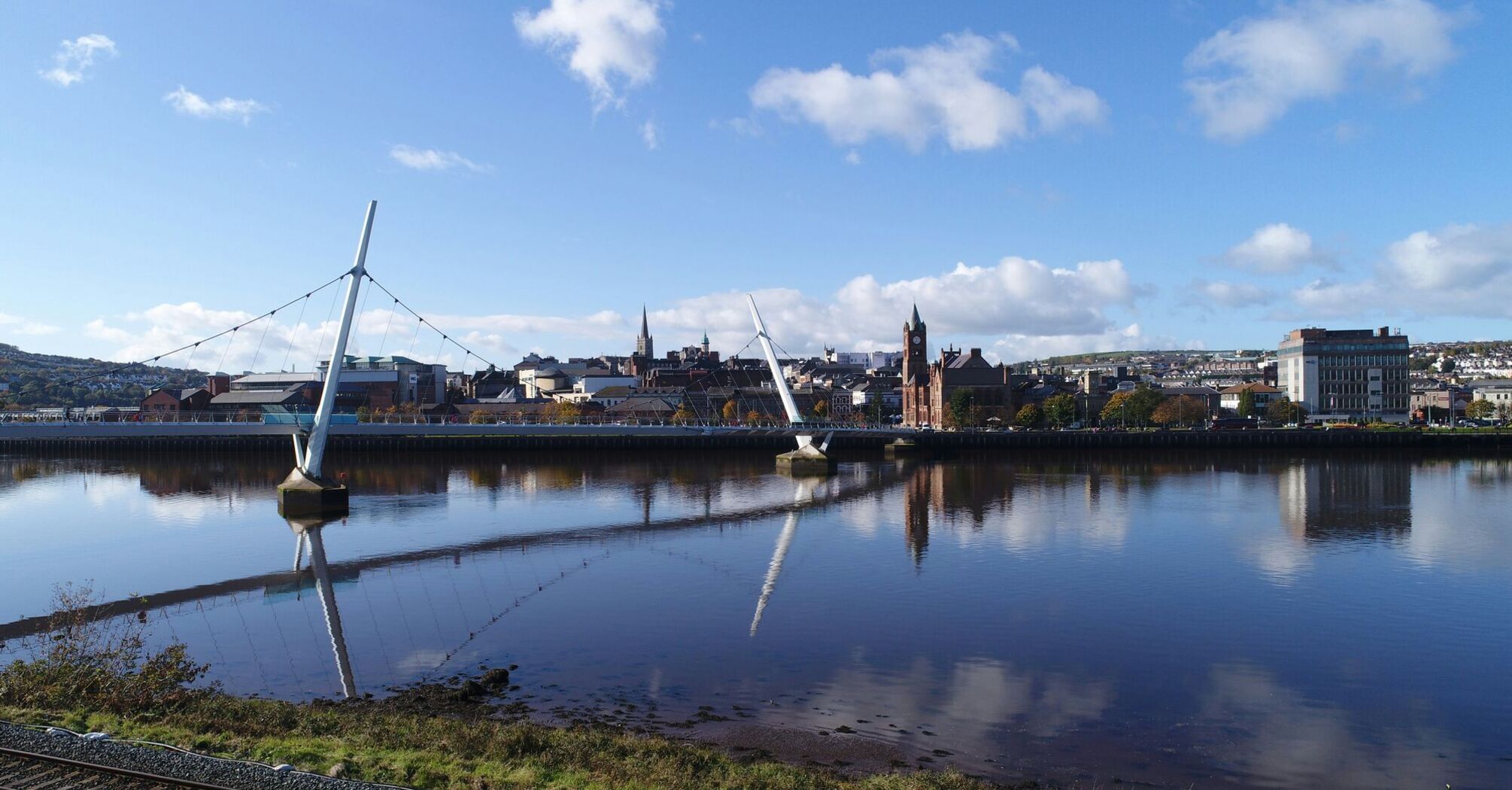 Reflections of the Derry Skyline on the River Foyle on a calm day.