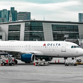 white passenger plane on airport during daytime