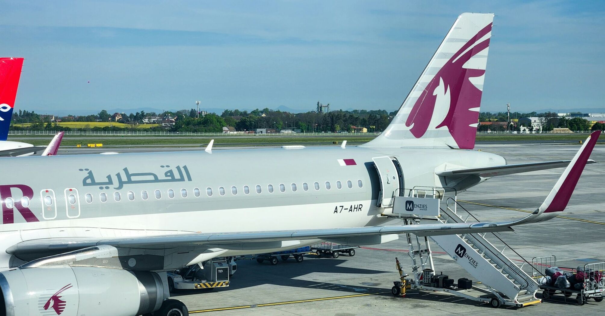 a large jetliner sitting on top of an airport tarmac