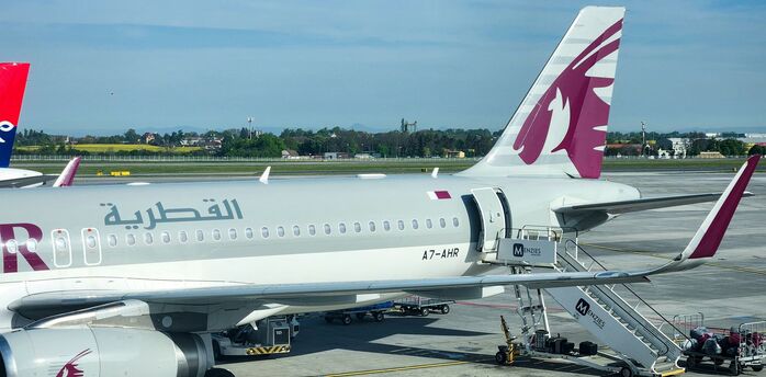 a large jetliner sitting on top of an airport tarmac